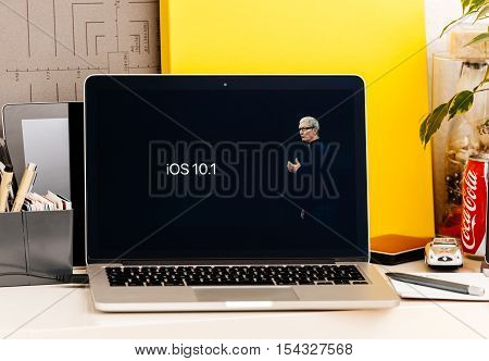 PARIS FRANCE - OCT 28 2016: Apple Computers website on new MacBook Pro Retina with OLED Touch bar in geek creative room showcasing Apple Keynote presentation of iOS 10.10 security