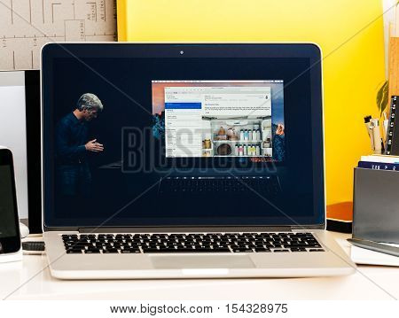 PARIS FRANCE - OCT 28 2016: Apple Computers website on new MacBook Pro Retina with OLED Touch bar in geek creative room showcasing Apple Keynote presentation Craig Federighi talking about new MacBook Pro