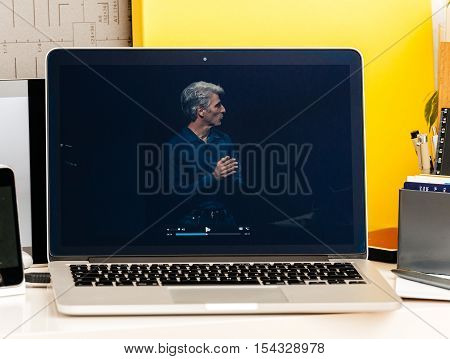 PARIS FRANCE - OCT 28 2016: Apple Computers website on new MacBook Pro Retina with OLED Touch bar in geek creative room showcasing Apple Keynote Craig Federighi - senior vice president of Software Engineering