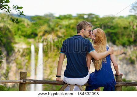 Young Couple Enjoying A View On Chamarel Falls