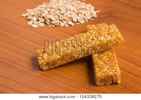 Muesli Bars. Nutri Oat Protein Bars over a wooden table