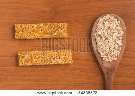Muesli Bars. Nutri Oat Protein Bars over a wooden table