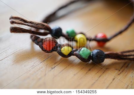 Vintage female bracelets on brown wood background