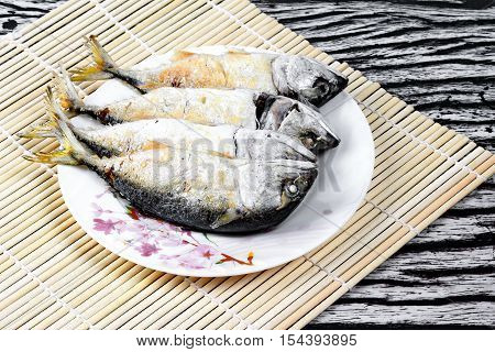 Deep fired streamed - mackarel on dish.
