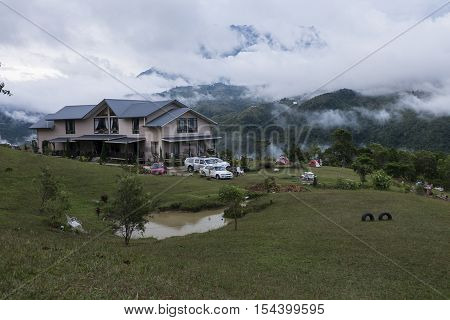 SABAH,BORNEO,Bundu Tuhan, Kundasang-August 29,2016: Cloudy sky scenery of Mount Kinabalu from Hounon Ridge Farmstay
