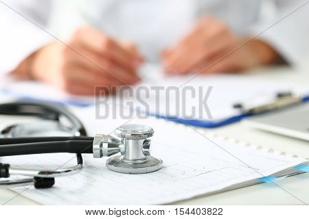 Medical Stethoscope Lying On Cardiogram Chart Closeup