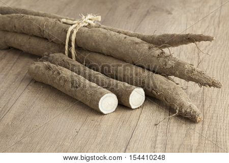 Bunch of fresh whole and half burdock taproots