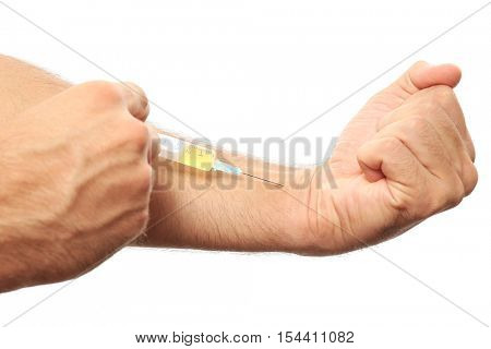 Muscular man injecting steroids on white background