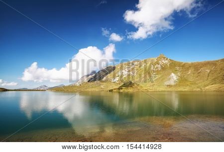 beautiful sky reflected in alpine lake Schrecksee Germany