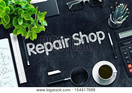 Black Chalkboard with Repair Shop Concept. 3d Rendering. Toned Image.