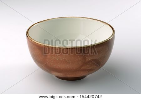 Ocher hand-crafted chinese bowl isolated on white background