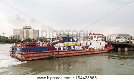 Vienna / Austria - July 21st 2014: Closeup picture of Mercur 201 romanian cargo boat pushing a barge on the Danube river