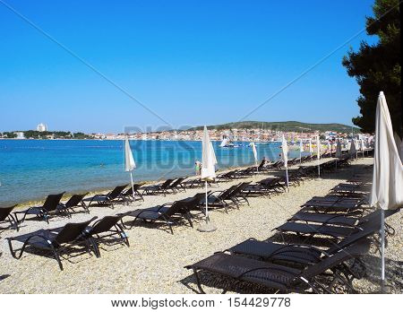 Beach with pines in Vodice in the sunset Croatia.