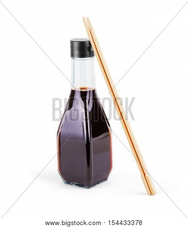 splashes of soy sauce and chopsticks isolated on white. wooden chopsticks dipped in soy sauce spilled.
