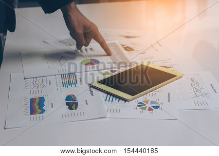 Business People Hands Working With A Tablet On White Table Background. Copy Space. Vintage Tone