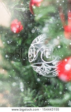 Christmas decorations on a Christmas tree under snow