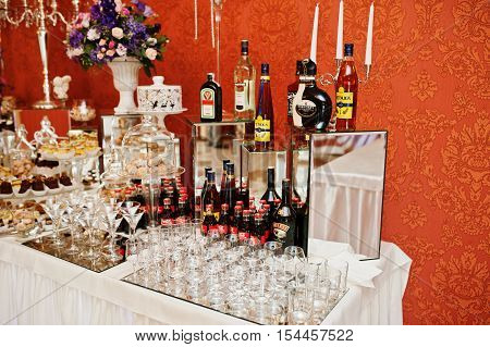 Hai, Ukraine - October 25, 2016: Diferrent Bottles Of Alcoholic Beverages  With Deserts And Fruits O