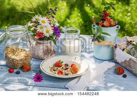Healthy breakfast with fruit and milk on old wooden table