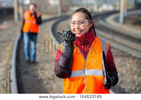 Man and a woman railroad workers maintaing railway