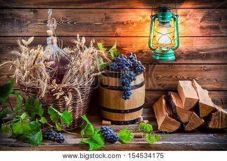 Grapes And Red Wine In A Demijohn