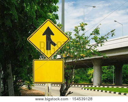 Beware right car traffic sign beside the road.