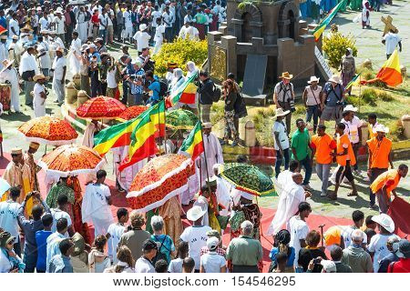 Gondar Ethiopia - January 19 2016: A crowd of faithful and tourists surrounding a procession in the annual religious celebration of Timket (epiphany)