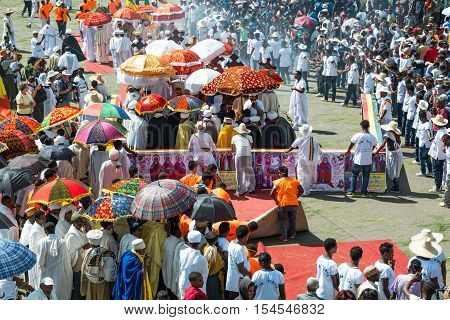 Gondar Ethiopia - January 19 2016: A crowd of faithful and tourists surrounding a procession in the annual religious celebration of Timket (epiphany)