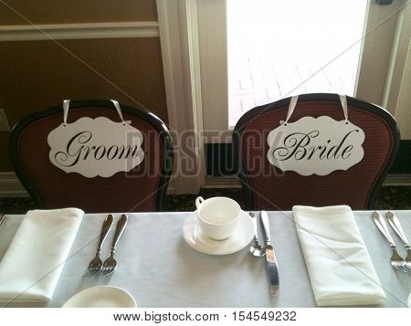 Bride and Groom decorative table seating signs