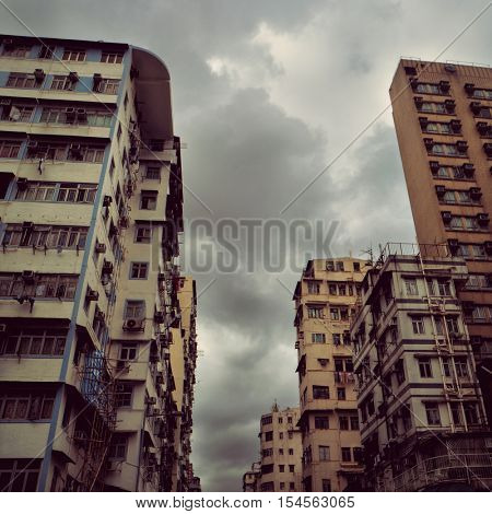 Hong Kong - October 2016: Kowloon street view with typical architecture. Retro look.