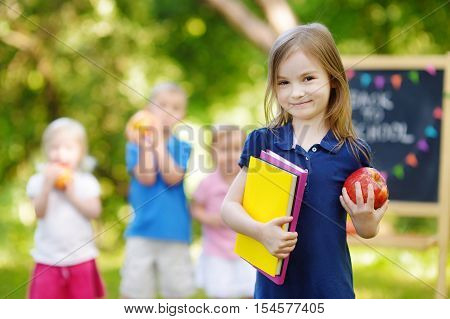 Excited Little Schoolgirl Going Back To School