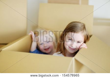 Two Cute Sisters Moving In Her New Home