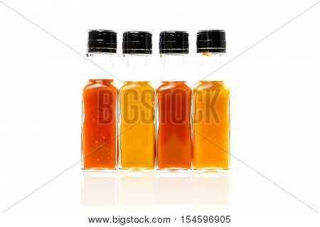 Different Color Home Made Hot Sauce In Glass Bottles