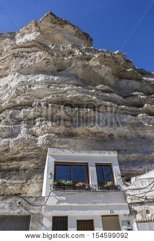 Alcala del Jucar Spain - October 29 2016: Cave House in the mountains of limestone next to the banks of the river Jucar take in Alcala of the Jucar Albacete province Spain