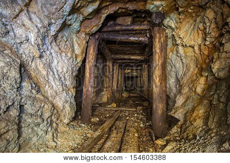 Old abandoned gold ore mine tunnel in Ural
