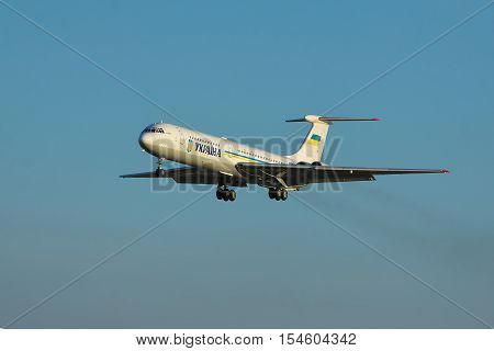 Borispol Ukraine - September 17 2011: Ukraine Government Ilyushin Il-62M passenger plane is landing against blue sky on sunset