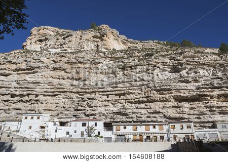 Alcala del Jucar Spain - October 29 2016: Cave House in the mountains of limestone next to the banks of the river Jucar take in Alcala of the Jucar Albacete province Spain