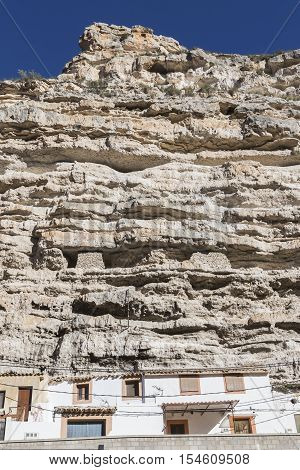 Alcala del Jucar Spain - October 29 2016: Cave House in the mountains of limestone next to the banks of the river Jucar take in Alcala of the Jucar Albacete province Spain
