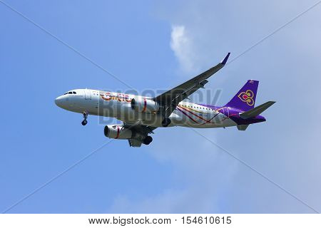 CHIANGMAI , THAILAND -APRIL 1 2014: HS-TXO Airbus A320-200 of Thaismile airway. Landing to Chiangmai airport from Phuket.