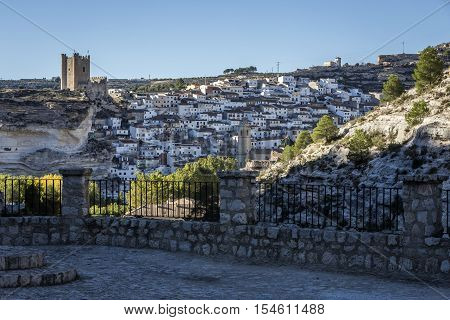 Alcala del Jucar Spain - October 29 2016: Panoramic view of the city on top of limestone mountain is situated Castle of the 12TH century Almohad origin take in Alcala of the Jucar Albacete province Spain