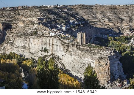 Alcala del Jucar Spain - October 29 2016: Panoramic view of the city on top of limestone mountain is situated Castle of the 12TH century Almohad origin take in Alcala of the Jucar Albacete province Spain