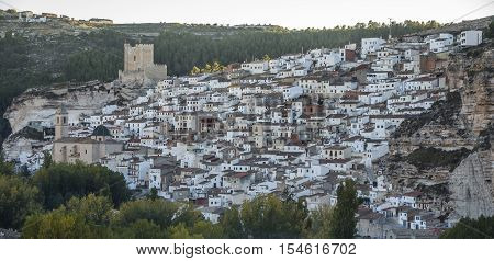 Alcala del Jucar Spain - October 29 2016: Panoramic view of the city on top of limestone mountain is situated Castle of the 12TH century Almohad origin take in Alcala of the Jucar Albacete province Spain