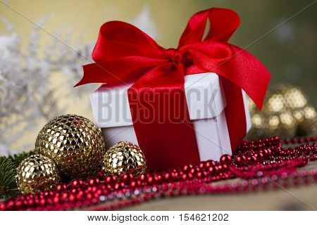 Beautiful gift box with red ribbon on Christmas backgroundGift box with red ribbon, Holiday Christmas background