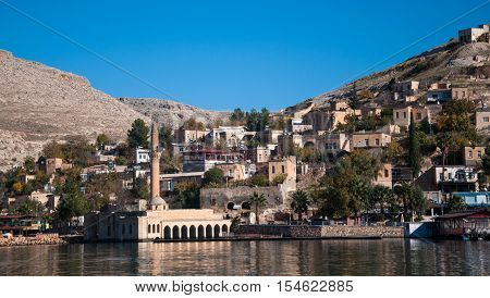 Gaziantep, Turkey - December 08, 2014: Minaret of the mosque in the water in village near Halfeti