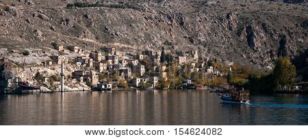 Gaziantep, Turkey - December 08, 2014: Minaret of the mosque in the water in village near Halfeti