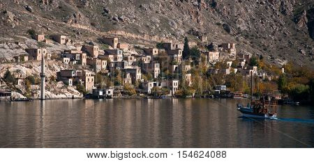 Gaziantep, Turkey - December 08, 2014: Minaret of the mosque in the water in village near Halfeti