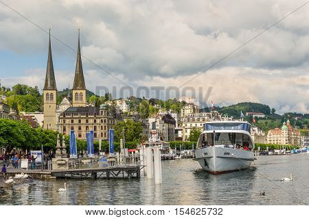 Lucerne Switzerland - May 24 2016: The Church of St. Leodegar with cityscape and Lake Lucerne Switzerland. Lucerne is a city in central Switzerland it is the capital of the Swiss Canton of Lucerne.