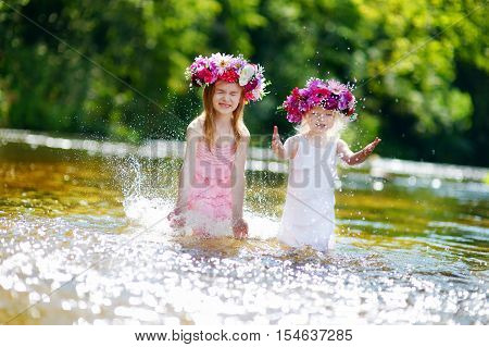 Two Sisters Having Fun By A River