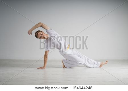 Man practicing Capoeira , brazilian martial Art.