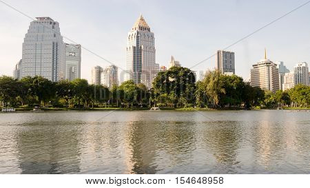 BANGKOK THAILAND-NOV 2 2015: Buildingtrees and pond view around Lumpini park. Center of Bangkok cityThailand. Nov 2 2015.
