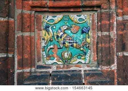 building wall decoration in the form of decorative glazed ceramic picture ceramic ornament closeup
